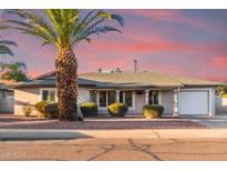 Charming single-story home featuring a desert landscaped yard and attached garage at 6838 E Almeria Rd, Scottsdale, AZ 85257