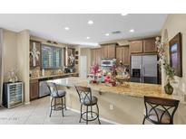 Modern kitchen with stainless steel appliances and an island at 1161 S Storment Ln, Gilbert, AZ 85296