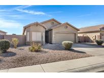 One-story house with a two-car garage and landscaped front yard at 1361 E Martha Dr, Casa Grande, AZ 85122