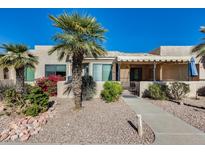 Inviting exterior with desert landscaping and covered patio at 14300 W Bell Rd # 480, Surprise, AZ 85374