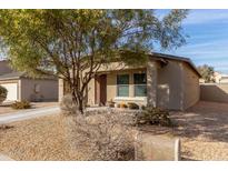 Single-story house with a landscaped yard and driveway at 194 E Watson Pl, Casa Grande, AZ 85122