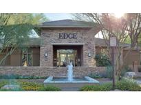 Attractive building exterior with stone accents and a water fountain at 20100 N 78Th Pl # 1092, Scottsdale, AZ 85255