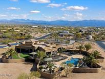 Luxury home with a large backyard, pool and putting green. Mountain views at 30014 N Baker Ct, Scottsdale, AZ 85262