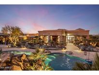 Luxury estate with expansive backyard oasis, featuring a stunning pool and inviting patio area at 30014 N Baker Ct, Scottsdale, AZ 85262