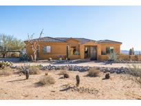 Desert landscape home with stucco exterior and tile roof at 31617 N 168Th St, Rio Verde, AZ 85263