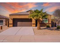 Charming single-story home boasts a well-maintained front yard, and a spacious two-car garage at 41838 W Chatham Pl, Maricopa, AZ 85138