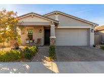 Single-story home with a two-car garage and landscaped front yard at 10333 E Tahoe Ave, Mesa, AZ 85212