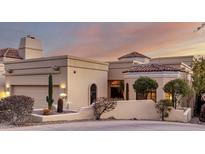 Stunning desert contemporary home with a tile roof and landscaped grounds at 13503 E Summit Dr, Scottsdale, AZ 85259