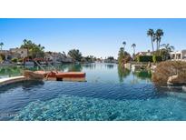 Luxury pool with lake access, offering serene waterfront views at 1519 E Treasure Cove Dr, Gilbert, AZ 85234