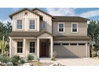 Two-story home with light-colored siding, brown accents, and a three-car garage at 1932 W Rowel Rd, Phoenix, AZ 85085
