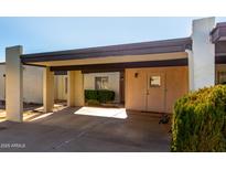 Front view of a condo with carport and landscaped area at 3013 W Redfield Rd, Phoenix, AZ 85053