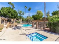 Inviting pool and spa area with lounge chairs and a relaxing atmosphere at 3825 E Camelback Rd # 239, Phoenix, AZ 85018