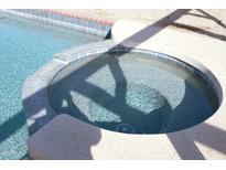 Relaxing hot tub adjacent to a refreshing swimming pool at 4234 E Winnetka Dr, Phoenix, AZ 85044