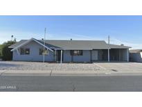 Charming single-story home with a well-maintained front yard at 10331 W Willie Low Cir, Sun City, AZ 85351