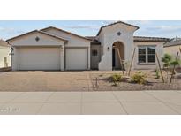 Charming single-story home with a three-car garage and well-maintained desert landscaping at 12316 W Parkway Ln, Avondale, AZ 85323