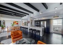 Modern kitchen with stainless steel appliances and breakfast bar at 1308 E Gardenia Dr, Phoenix, AZ 85020