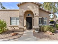 Front view of charming house with walkway and landscaping at 14300 W Bell Rd # 326, Surprise, AZ 85374