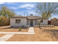 Remodeled single story home with desert landscaping and walkway at 1743 W Verde Ln, Phoenix, AZ 85015