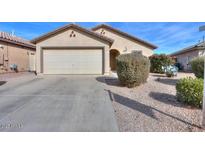 One-story house with a two-car garage and well-maintained landscaping at 18489 N Davis Dr, Maricopa, AZ 85138