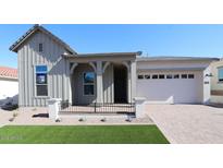 Charming single-Gathering home with a welcoming front porch and a two-car garage at 21537 W Pierson St, Buckeye, AZ 85396