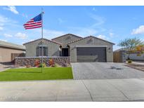 One-story home with a two-car garage and landscaped front yard at 37029 N Andravida Dr, San Tan Valley, AZ 85140