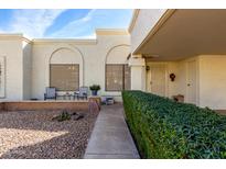 Landscaped front yard with walkway and shrubs at 7911 E Desert Trl, Mesa, AZ 85208