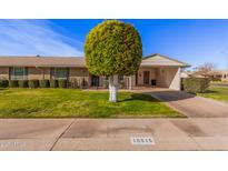 Ranch-style home with carport and well-manicured lawn at 10515 W El Capitan Cir, Sun City, AZ 85351