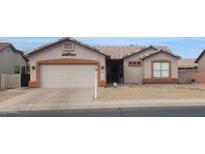 Charming single-story home featuring a well-maintained front yard and attached two-car garage at 1432 E Westchester Dr, Chandler, AZ 85249