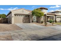 Two-car garage and well-manicured front yard at 22174 E Creekside Dr, Queen Creek, AZ 85142