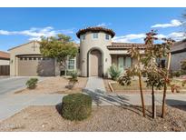 Single-story home with a unique architectural design and landscaping at 22174 E Creekside Dr, Queen Creek, AZ 85142