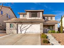 Two-story house with a large driveway and landscaped front yard at 6512 W Eagle Talon Trl, Phoenix, AZ 85083