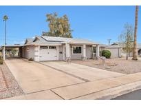 Updated single-story home with solar panels and a spacious driveway at 12451 N Cherry Hills E Dr, Sun City, AZ 85351