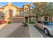 Two-story townhome with attached garage and balcony at 14250 W Wigwam Blvd # 2121, Litchfield Park, AZ 85340