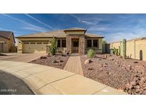 Single-story home with desert landscaping and a two-car garage at 17164 S 174Th Dr, Goodyear, AZ 85338