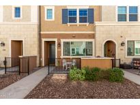 Front exterior of townhome with small patio and landscaping at 1852 E Chelsea Ln # 102, Gilbert, AZ 85295