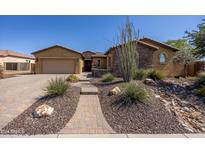 Beautiful desert landscape and a 3 car garage at 19334 W Pasadena Ave, Litchfield Park, AZ 85340