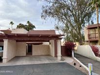 Spanish style home with covered parking and landscaped walkway at 2168 E Sanos Dr, Tempe, AZ 85281