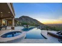 Luxury pool and spa with mountain views and sunset at 26905 N 98Th Way, Scottsdale, AZ 85262