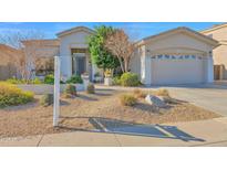 Single-story home with landscaped front yard and two-car garage at 4835 E Daley Ln, Phoenix, AZ 85054