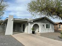 Newly painted single story home with carport and spacious driveway at 660 W 22Nd Ave, Apache Junction, AZ 85120