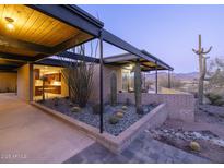 Mid-century modern home with desert landscaping and mountain views at 7724 E Long Rifle Rd, Carefree, AZ 85377