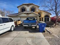 Two-story house with a driveway and landscaping at 8501 W Vernon Ave, Phoenix, AZ 85037