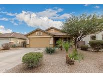 Single-story home with desert landscaping and a two-car garage at 851 E Bradstock Way, San Tan Valley, AZ 85140