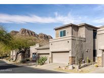 Two-story stucco home with attached garage and mountain views at 10164 E Dinosaur Ridge Rd, Gold Canyon, AZ 85118