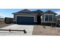 Charming single-story home with a two-car garage and low-maintenance gravel landscaping at 1543 E Lardner Dr, Casa Grande, AZ 85122