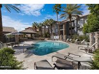 Inviting community pool with lounge chairs at 2025 E Campbell Ave # 140, Phoenix, AZ 85016