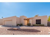 Single-story home with desert landscaping and two-car garage at 26006 S Eastlake Dr, Sun Lakes, AZ 85248