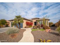 Single-story home with desert landscaping, a curved walkway, and a two-car garage at 26916 W Potter Dr, Buckeye, AZ 85396