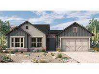 Craftsman style home with gray siding, stone accents, and a two-car garage at 32464 N 134Th Ln, Peoria, AZ 85383