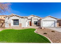 One-story home with a landscaped yard, two-car garage, and neutral exterior at 3332 E Powell Pl, Chandler, AZ 85249